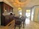 Comfortable dining room featuring a dark hutch for storage at 225 N Saint Thomas Cir, Apollo Beach, FL 33572