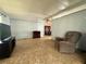 Spacious living room with tile floors and a view into the dining area at 225 N Saint Thomas Cir, Apollo Beach, FL 33572
