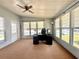 Office space featuring a ceiling fan, desk, and carpeted floors at 225 N Saint Thomas Cir, Apollo Beach, FL 33572