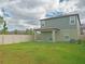 Spacious backyard with green grass and fence at 22547 Storybook Cabin Way, Land O Lakes, FL 34637