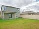 Large backyard with grassy area and privacy fence at 22547 Storybook Cabin Way, Land O Lakes, FL 34637