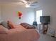 Bedroom with queen bed, TV and ceiling fan at 22547 Storybook Cabin Way, Land O Lakes, FL 34637