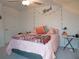 Cozy bedroom with queen bed and decorative accents at 22547 Storybook Cabin Way, Land O Lakes, FL 34637