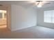 Large bedroom with ensuite bathroom access and window at 22547 Storybook Cabin Way, Land O Lakes, FL 34637