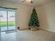 Living room with sliding glass doors leading to the backyard at 22547 Storybook Cabin Way, Land O Lakes, FL 34637
