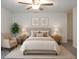Serene main bedroom with neutral decor, a ceiling fan, carpet flooring, and ample natural light at 22547 Storybook Cabin Way, Land O Lakes, FL 34637