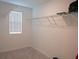 Walk-in closet with wire shelving and window at 22547 Storybook Cabin Way, Land O Lakes, FL 34637