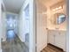 Clean bathroom with vanity and view into hallway at 22702 Penny Loop, Land O Lakes, FL 34639