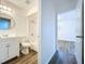 Bathroom with tub, vanity, and view of bedroom at 22702 Penny Loop, Land O Lakes, FL 34639