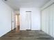 Bright bedroom with wood-look floors and sliding door at 22702 Penny Loop, Land O Lakes, FL 34639