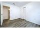 Small bedroom with wood-look flooring and closet at 22702 Penny Loop, Land O Lakes, FL 34639