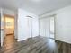 Bedroom with wood-like floors, sliding door and closet at 22702 Penny Loop, Land O Lakes, FL 34639