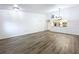 Bright dining room adjacent to kitchen, featuring wood-look flooring at 22702 Penny Loop, Land O Lakes, FL 34639