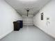 Spacious garage with epoxy floor and ample storage space at 22702 Penny Loop, Land O Lakes, FL 34639