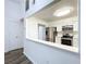 Modern kitchen with stainless steel appliances, white cabinets, and hardwood floors at 22702 Penny Loop, Land O Lakes, FL 34639