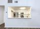 Updated kitchen boasts stainless steel appliances and white cabinetry at 22702 Penny Loop, Land O Lakes, FL 34639