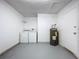 Laundry room with washer, dryer, and water heater at 22702 Penny Loop, Land O Lakes, FL 34639