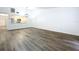 Bright living room featuring modern wood floors and an open floor plan at 22702 Penny Loop, Land O Lakes, FL 34639