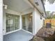 Private patio with sliding glass doors leading to the interior at 22702 Penny Loop, Land O Lakes, FL 34639