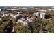 Complex aerial view of multiple condos surrounded by mature landscaping and covered parking spots at 2650 Pearce Dr # 106, Clearwater, FL 33764