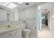 Neat bathroom with a single sink vanity and a shower with a blue curtain at 2650 Pearce Dr # 106, Clearwater, FL 33764