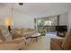 Cozy living room with large windows and comfortable seating at 2650 Pearce Dr # 106, Clearwater, FL 33764