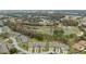 Aerial view of residential community adjacent to a golf course at 3309 Lori Ln, New Port Richey, FL 34655