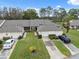 Two-unit building with attached garages and a beautiful lawn at 3309 Lori Ln, New Port Richey, FL 34655
