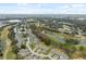Aerial view of homes and landscape, showcasing a community near a golf course at 3309 Lori Ln, New Port Richey, FL 34655