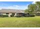 Large backyard with a screened patio and great lawn space at 3309 Lori Ln, New Port Richey, FL 34655