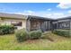 Private backyard with screened patio and lush landscaping at 3309 Lori Ln, New Port Richey, FL 34655