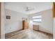 Guest bedroom with wood floors and ceiling fan at 3309 Lori Ln, New Port Richey, FL 34655