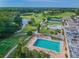 Aerial view of resort-style pool and surrounding green space at 3309 Lori Ln, New Port Richey, FL 34655