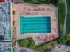 Aerial view of community lap pool with surrounding lounge chairs and umbrellas at 3309 Lori Ln, New Port Richey, FL 34655