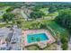 Aerial view of community pool and surrounding residential area at 3309 Lori Ln, New Port Richey, FL 34655