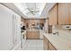 Bright kitchen features white appliances and ample cabinetry at 3309 Lori Ln, New Port Richey, FL 34655