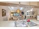 Kitchen with breakfast bar and view into dining area at 3309 Lori Ln, New Port Richey, FL 34655