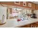 View of kitchen with white appliances and breakfast nook at 3309 Lori Ln, New Port Richey, FL 34655