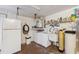 Functional laundry room with washer, dryer, and extra storage at 3309 Lori Ln, New Port Richey, FL 34655