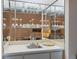 Wet bar with mirrored backsplash and glass shelving at 3309 Lori Ln, New Port Richey, FL 34655