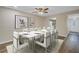Formal dining room with contemporary decor, seating for eight, and views into the kitchen at 3500 Lake Bayshore Dr # K-101, Bradenton, FL 34205