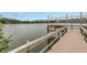 Scenic dock overlooking tranquil lake; perfect spot to relax and enjoy the serene water view at 3500 Lake Bayshore Dr # K-101, Bradenton, FL 34205
