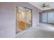 Enclosed patio with tile floor features access via sliding glass door; ceiling fan provides comfort at 3500 Lake Bayshore Dr # K-101, Bradenton, FL 34205