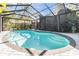 Inviting screened pool with patio and lush landscaping offers a private outdoor oasis at 4595 Northwood Ter, Sarasota, FL 34234