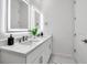 Contemporary bathroom featuring dual sinks, modern fixtures, illuminated mirrors, and clean, minimalist design at 600 3Rd S Ave # 401, St Petersburg, FL 33701