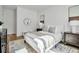 Bright bedroom featuring a plush bed with a stylish rug and modern decor at 600 3Rd S Ave # 401, St Petersburg, FL 33701