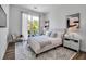 Bright, airy bedroom with large window, neutral color scheme, stylish decor and ample natural light at 600 3Rd S Ave # 401, St Petersburg, FL 33701