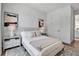 Serene bedroom with plush bedding, soft lighting, and a calm color palette with stylish decor at 600 3Rd S Ave # 401, St Petersburg, FL 33701
