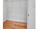 Walk-in closet with hardwood floors, wire shelving, and ample storage space with a door to the right at 600 3Rd S Ave # 401, St Petersburg, FL 33701
