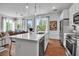 Open concept kitchen island with pendant lighting, stainless steel appliances, and breakfast bar at 600 3Rd S Ave # 401, St Petersburg, FL 33701